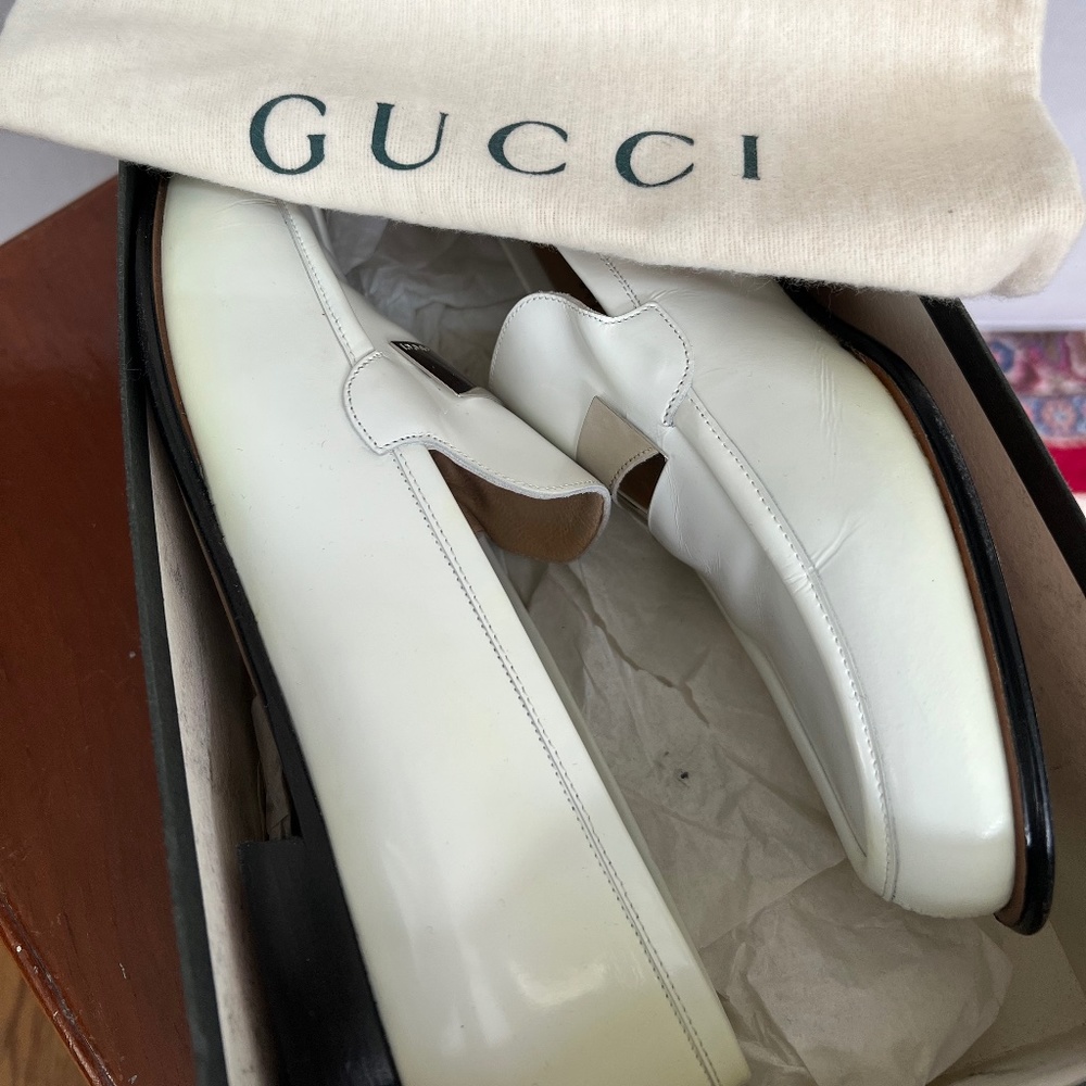 Gucci white leather loafers with silver accent